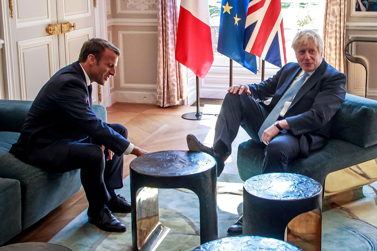 French President Emmanuel Macron and British Prime Minister Boris Johnson speak during a meeting at the Elysee Palace in Paris, France, 22 August 2019. Photo: Reuters