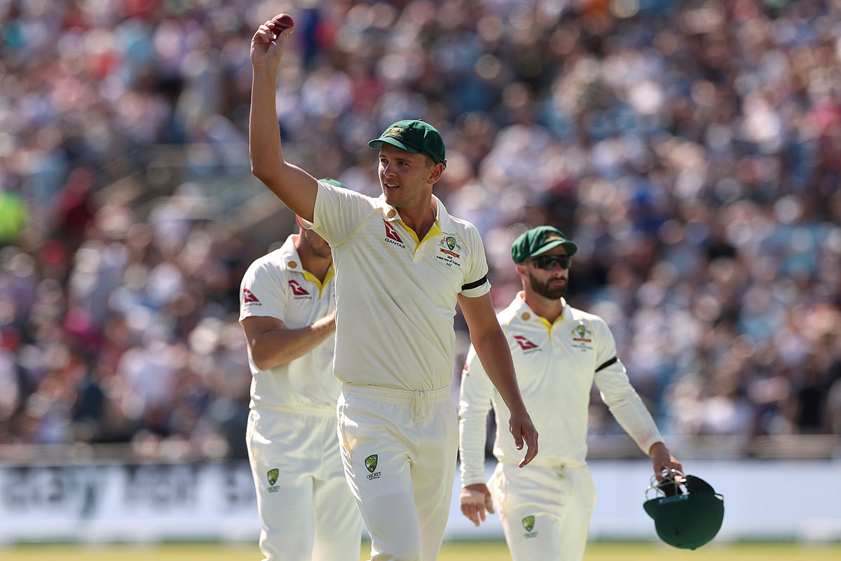 Australia`s Josh Hazlewood holds up the ball at the end of England`s 1st innings. Photo: Reuters