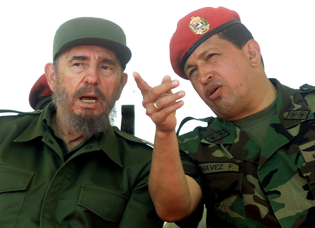 Venezuelan President Hugo Chavez talks with Cuban President Fidel Castro at the port of Pampatar on Margarita Island. Photo: Reuters