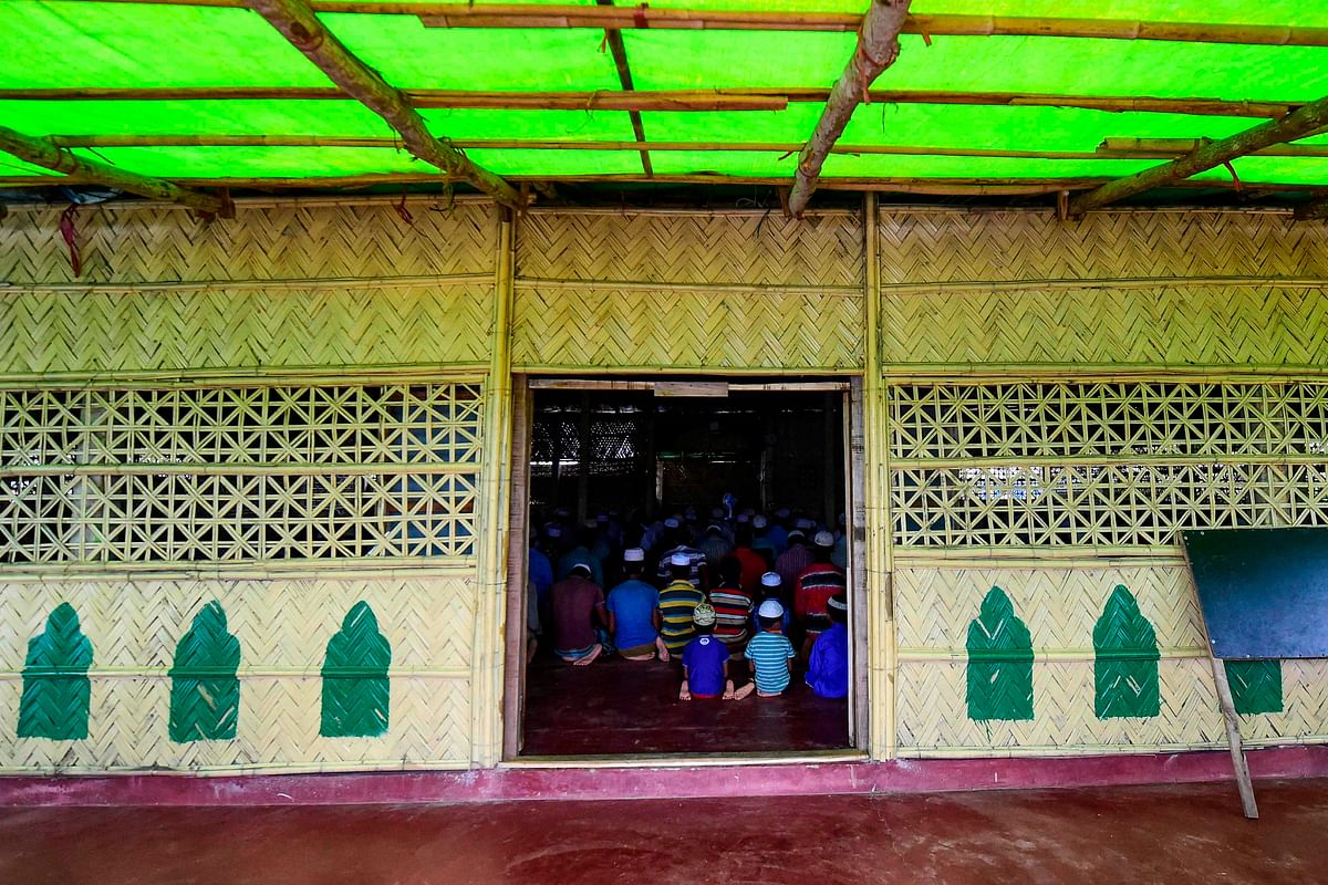 Rohingya Muslim refugees offer their Friday prayers at a mosque in the Kutupalong refugee camp in Ukhia district on 23 August 2019. Photo: AFP