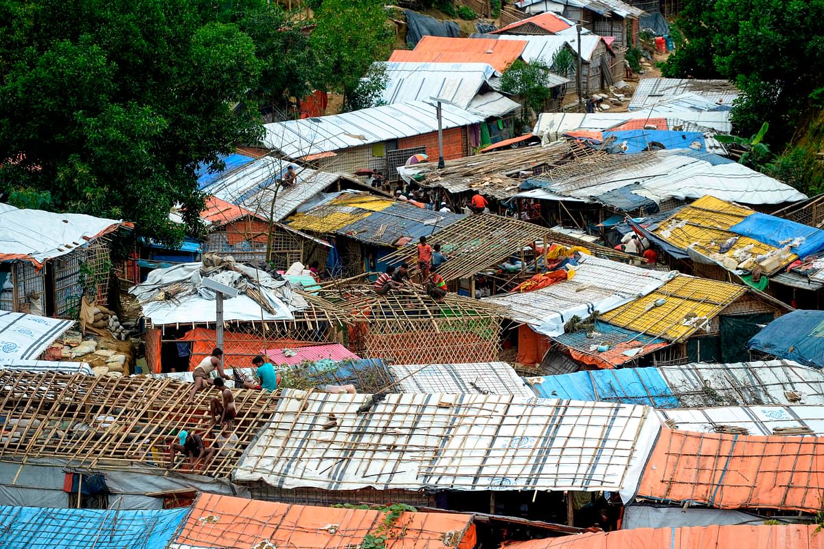 Rohingya refugees renovate makeshift houses at Kutupalong refugee camp in Ukhia, Cox’s Bazar on 23 August 2019. Photo: AFP