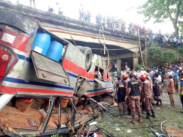 Six people were killed as a bus plunged into a roadsideditch breaking railing of a bridge on Dhaka-Khulna highway in Sadar upazila of Faridpur on Saturday. Photo: Alimuzzaman