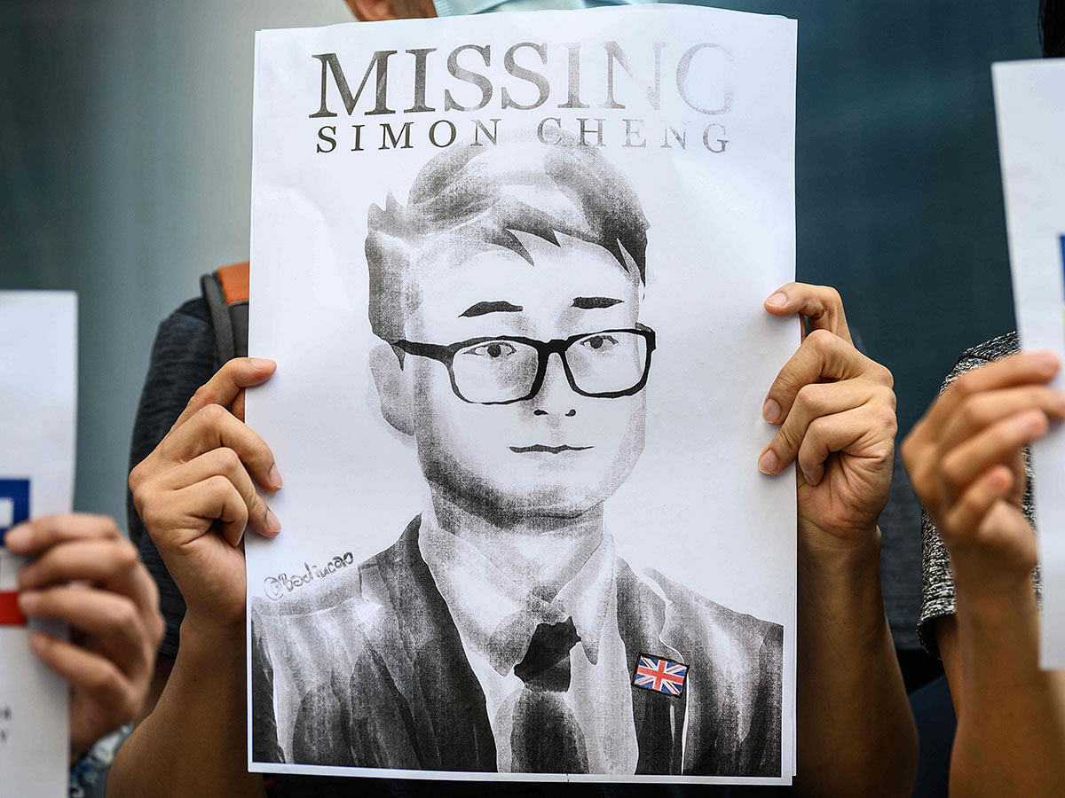 Activists gather outside the British Consulate-General building in Hong Kong on 21 August 2019, following reports that Simon Cheng, a Hong Kong consulate employee had been detained by mainland Chinese authorities on his way back to the city. Photo: AFP