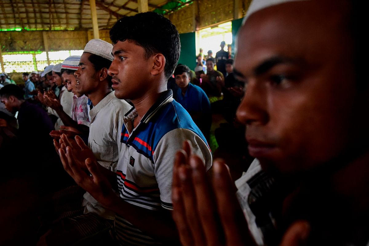Rohingya Muslim refugees offer their Friday prayers at a mosque in the Kutupalong refugee camp in Ukhia district on 23 August 2019. Photo: AFP