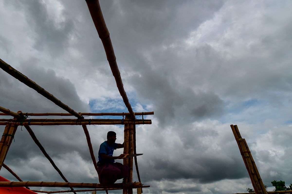 A Rohingya refugee builds a makeshift office at Kutupalong refugee camp in Ukhiya, Cox`s Bazar district on 23 August 2019. Photo: AFP