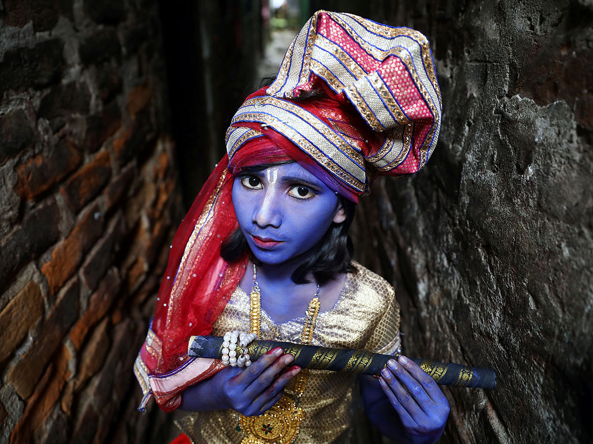 A child dressed as Hindu Lord Krishna poses during the festival of Janmashtami, marking the birth of Hindu Lord Krishna, in Dhaka, Bangladesh, 23 August 2019. Photo: Reuters