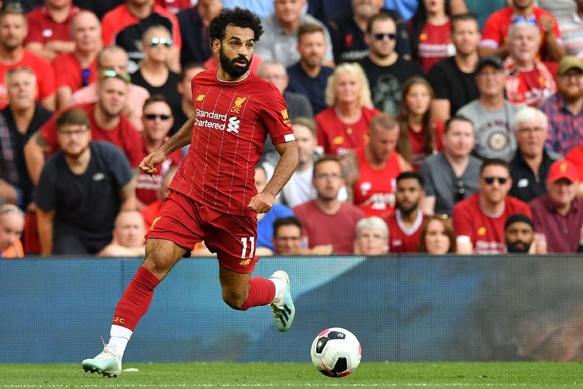 Liverpool`s Egyptian midfielder Mohamed Salah runs with the ball during the English Premier League football match between Liverpool and Arsenal at Anfield in Liverpool, north west England on 24 August 2019. Photo: AFP