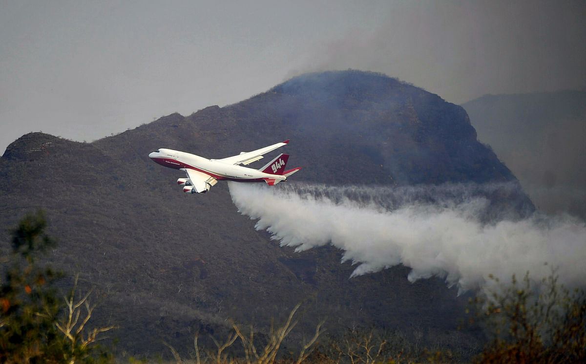 View of a Supertanker, an aerial firefighting airtanker, overflying the fires raging near Robore, Santa Cruz region, eastern Bolivia on 23 August 2019. Photo: AFP
