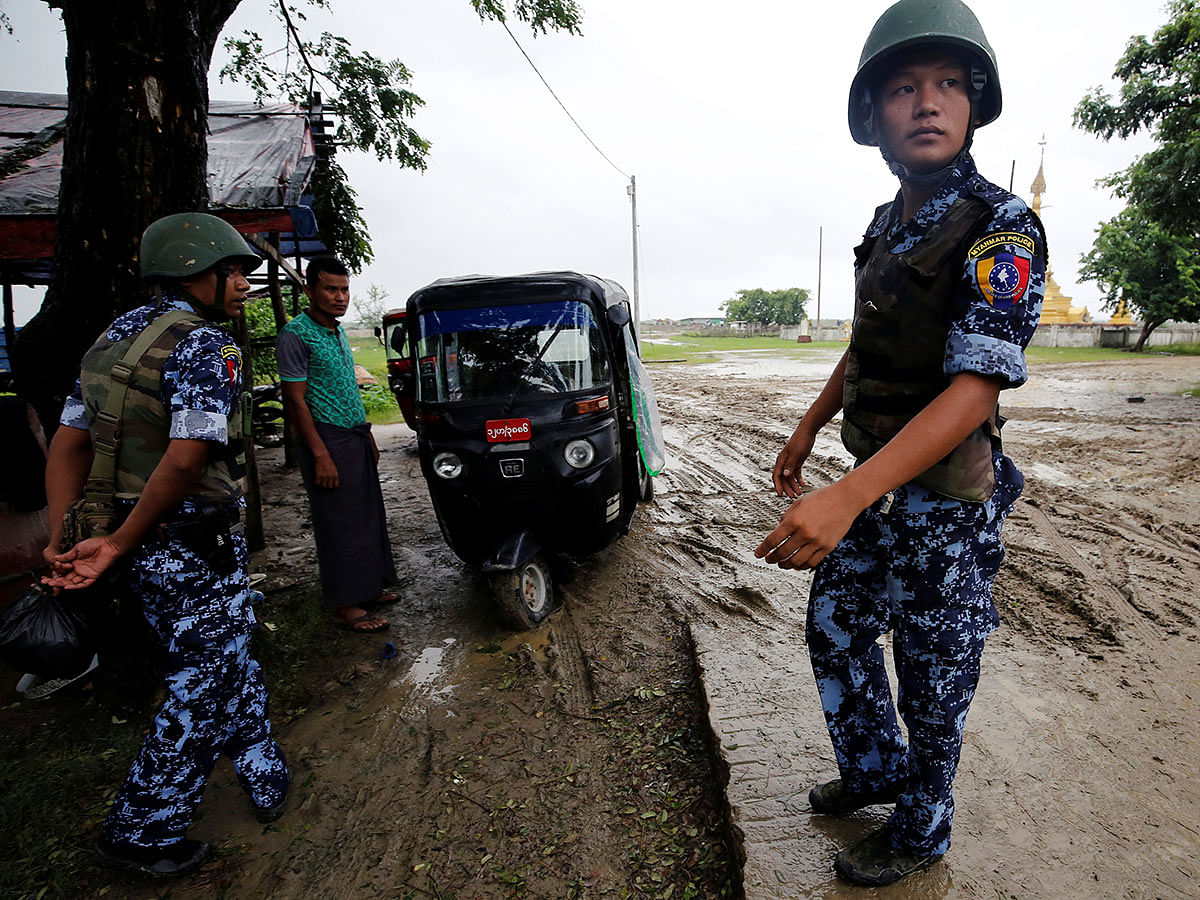 Myanmar police officer stands guard in Maungdaw, Rakhine on 9 July. Photo: Reuters