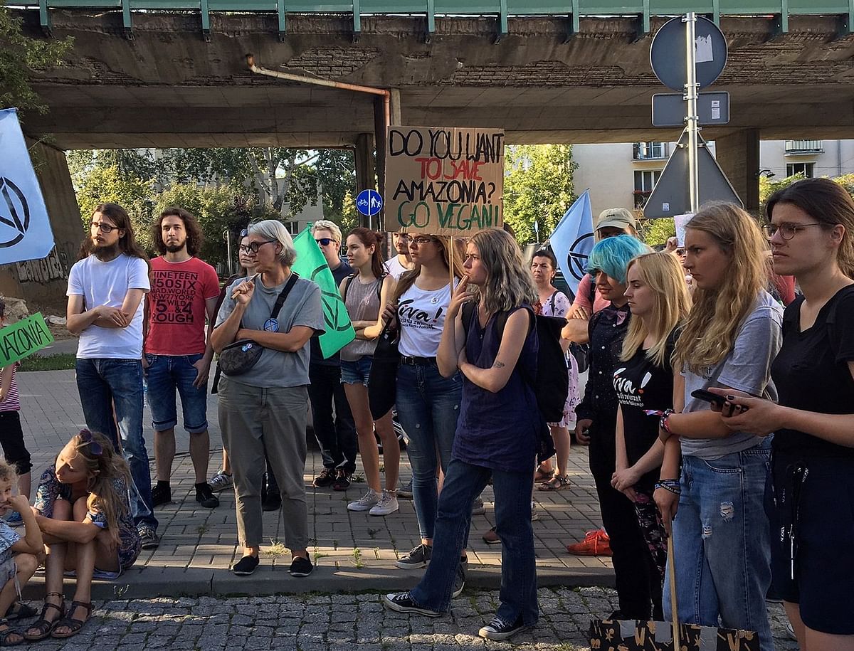 Some one hundred young green activists gather in front of the Brazilian embassy in Warsaw, Poland on 24 August 2019 to read a petition addressed to the Brazilian authorities to ask them to protect Amazon forest against ongoing fires. Photo: AFP