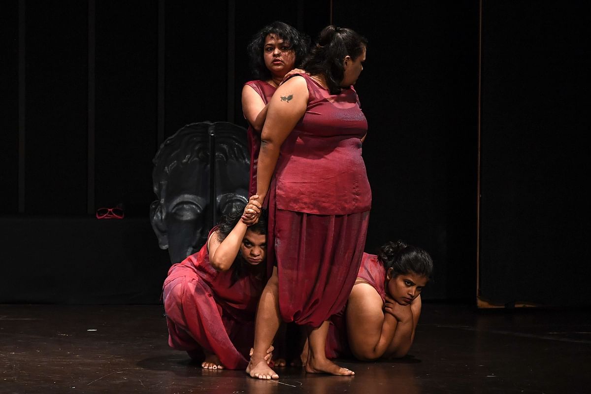 In this photo taken on 24 August 2019, performers take part in a production of the show `Head 2 Head` in a theatre at the Indian Habitat Centre in New Delhi. Photo: AFP
