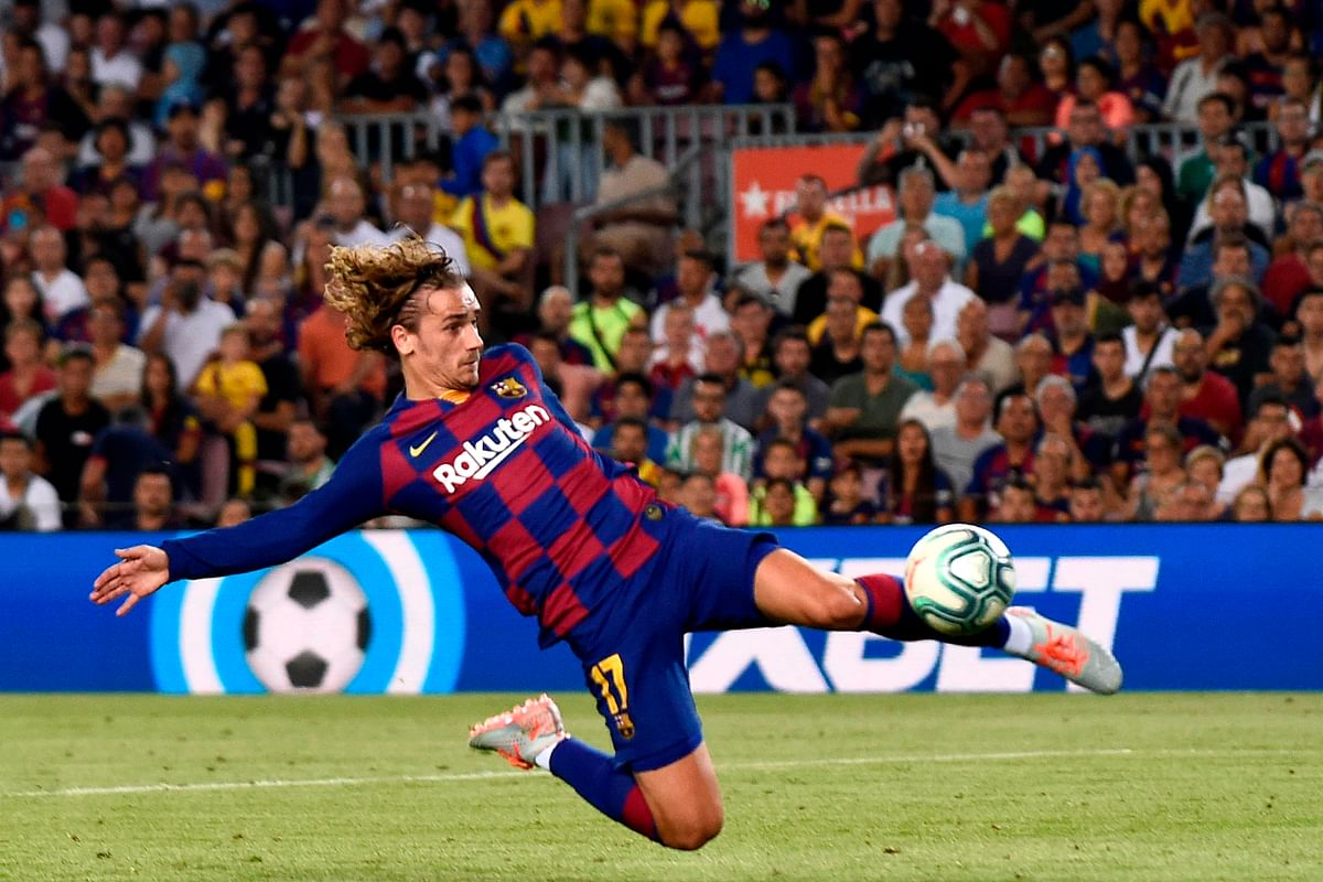 Barcelona’s French forward Antoine Griezmann scores a goal during the Spanish League football match between Barcelona and Real Betis at the Camp Nou stadium in Barcelona on Sunday. Photo: AFP