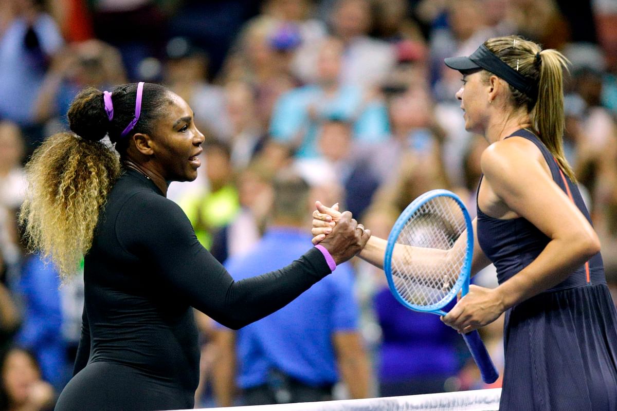 Maria Sharapova ® of Russia shake hands after losing against Serena Williams of the United Sates during their Round 1 women’s Singles match at the 2019 US Open at the USTA Billie Jean King National Tennis Center in New York on Monday. Photo: AFP