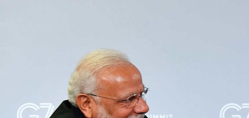 Indian prime minister Narendra Modi (L) and US president Donald Trump shakes hands as they speak during a bilateral meeting in Biarritz, south-west France on 26 August 2019, on the third day of the annual G7 Summit