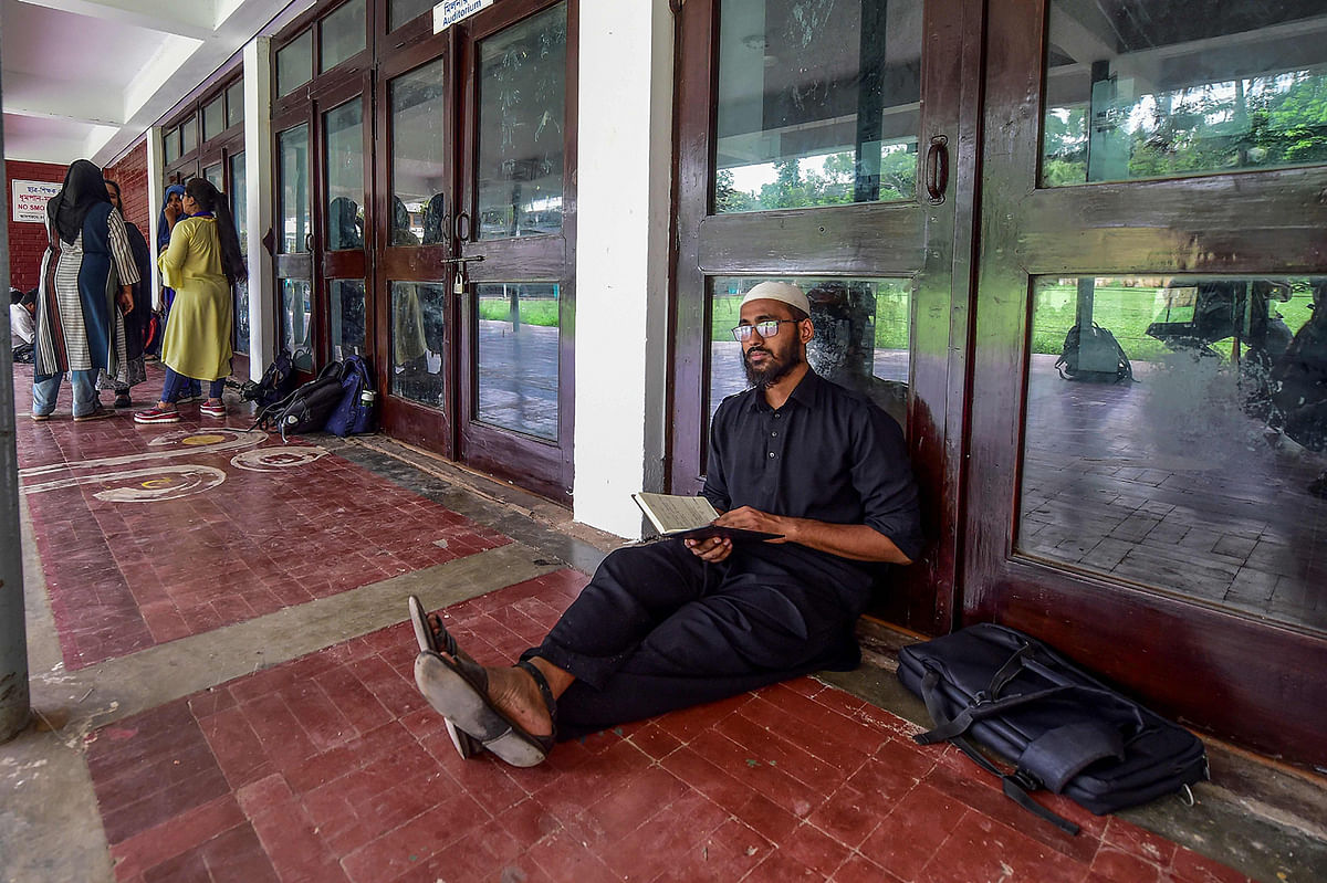 In this photo taken on 15 July 2019, Hojaifa al Mamduh, a former madrasastudent who is now studying journalism at a Dhaka university, poses for a photo in Dhaka. Photo: AFP