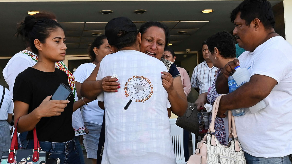 Relatives and friends of victims of a shooting at a night club react outside the Veracruz`s General Prosecutor`s Office in Coatzacoalcos, Mexico on 28 August 2019. Photo: AFP