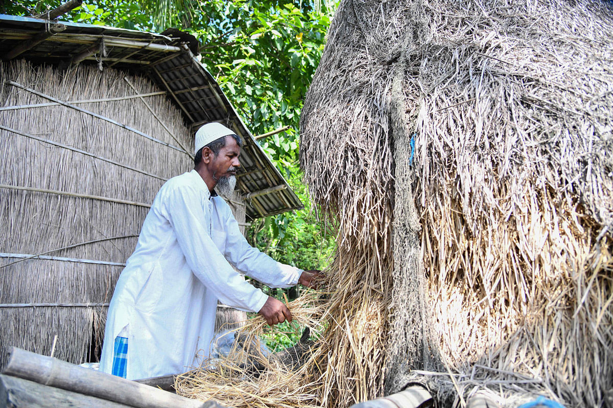 In this photo taken on 29 August 2019, Saheb Ali, 55, works at his home in Khutamari village in Goalpara district, some 160km from Guwahati, the capital city of India’s northeastern state of Assam. Photo: AFP