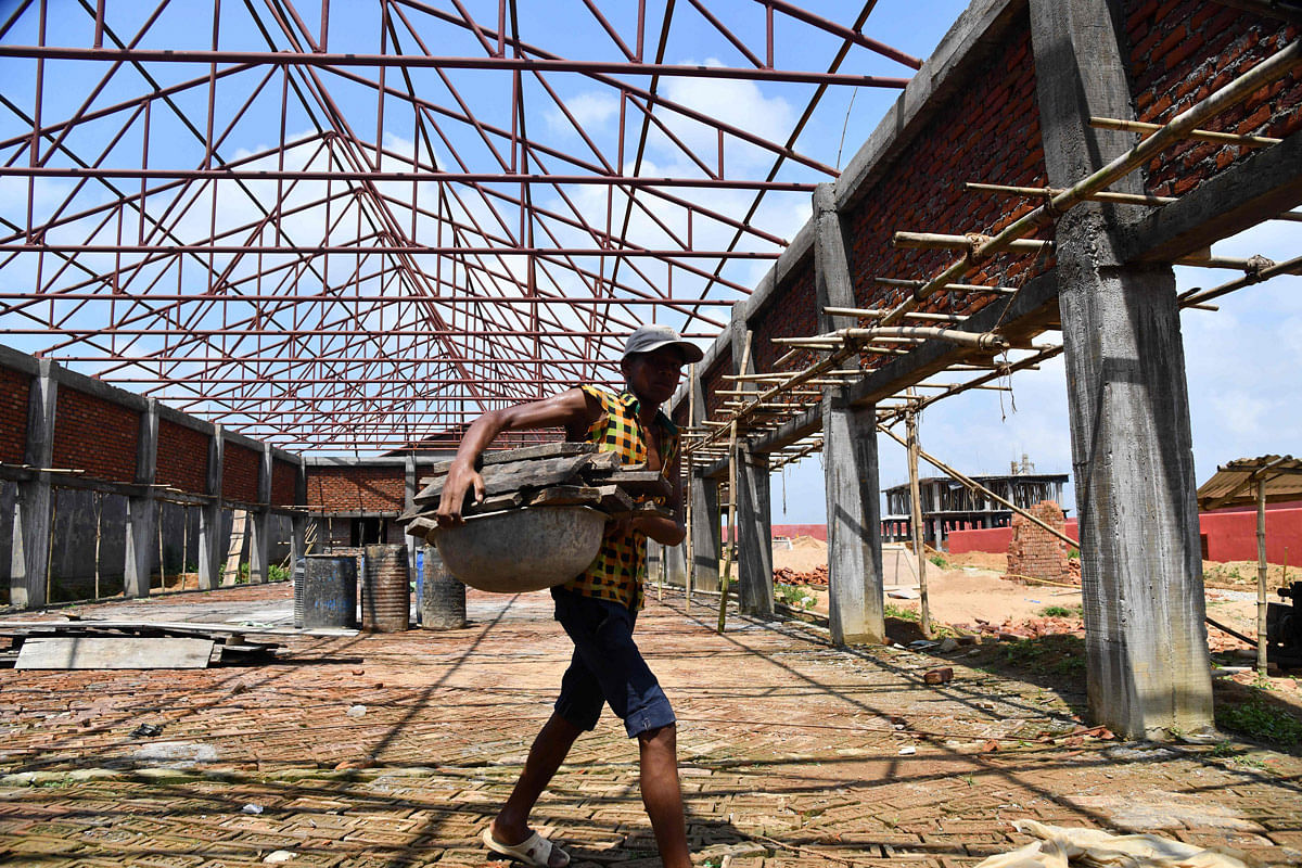This photo taken on 29 August 2019, shows a labourer working on a new detention centre being built for people who are not included in a `citizens register` in Kadamtola Gopalpur village, in Goalpara district, some 170km from Guwahati, the capital city of India’s northeastern state of Assam. Photo: AFP