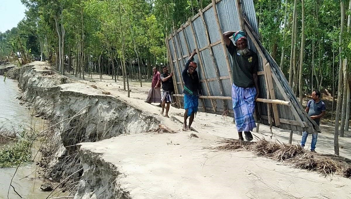 People shift their homes as the Brahmaputra erosion takes a serious turn. Photo: UNB