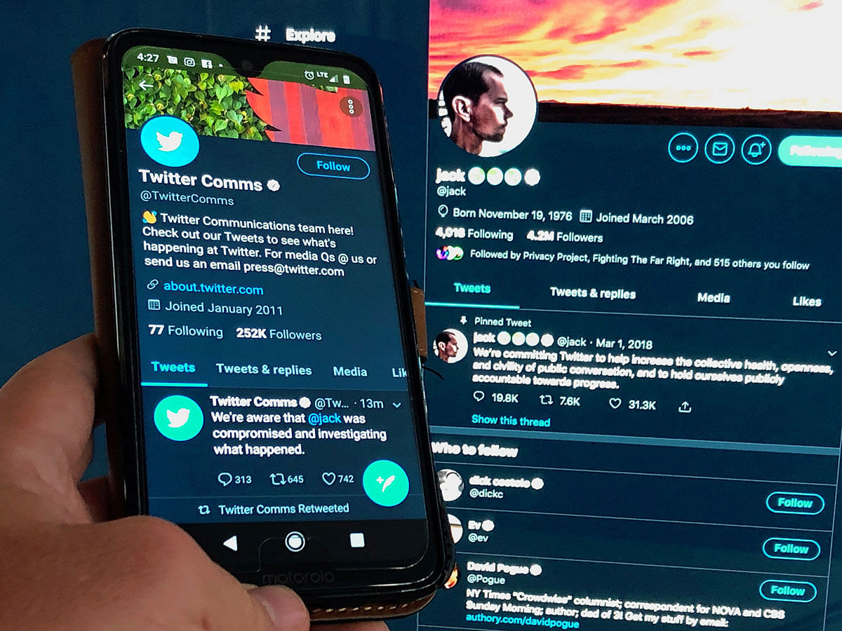 A message from the Twitter communications department confirming the hacking of co-founder and CEO Jack Dorsey`s Twitter account and his postings is seen on a mobile phone held in front of Dorsey`s twitter feed displayed on a computer screen in this photo illustration taken in Washington, US on 30 August 2019. Photo: Reuters
