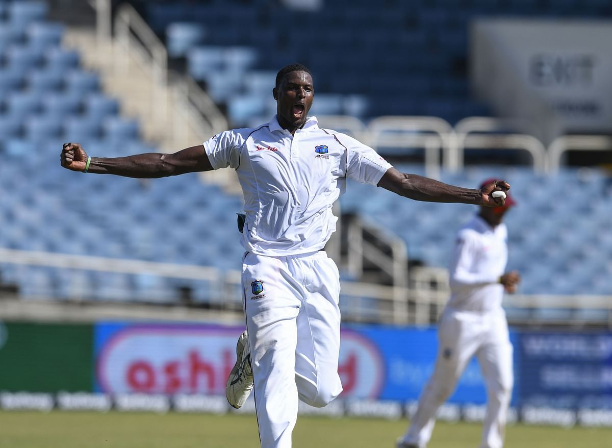 Jason Holder of West Indies celebrates the dismissal of Virat Kohli of India during day 1 of the 2nd Test between West Indies and India at Sabina Park, Kingston, Jamaica, on 30 August 2019. Photo: AFP