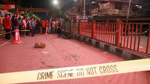 Police cordon the spot, where bomb attack was taken place aiming police, with security tape in Science Lab intersection area, Dhaka on Saturday night. Photo: Tanvir Ahmed