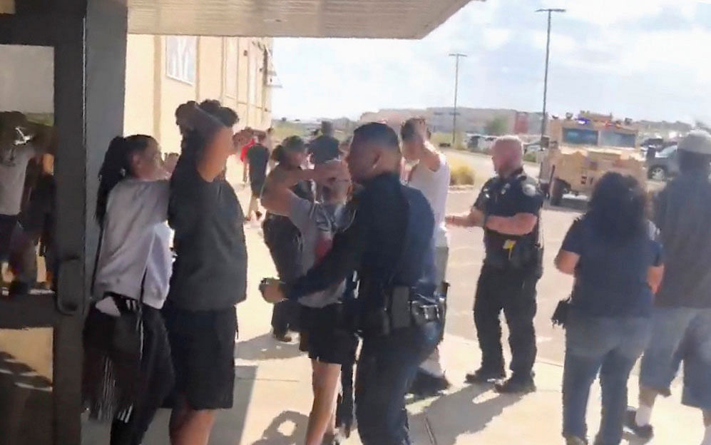 People are evacuated from Cinergy Odessa cinema following a shooting in Odessa, Texas, US in this still image taken from a social media video on 31 August. Photo: Reuters