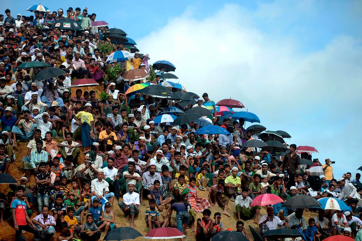 Rohingya refugees attend a ceremony organised to remember the second anniversary of a military crackdown that prompted a massive exodus of people from Myanmar to Bangladesh, at the Kutupalong refugee camp in Ukhia on 25 August 2019. Photo: AFP