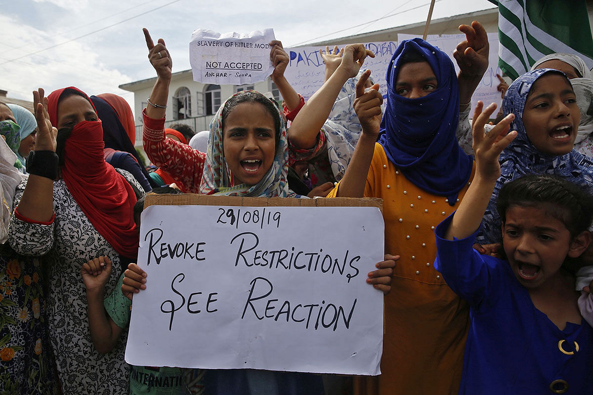 Indian Kashmiri protestors shout slogans during a protest at Anchar area on the outskirts of Srinagar on 30 August. Photo: AFP