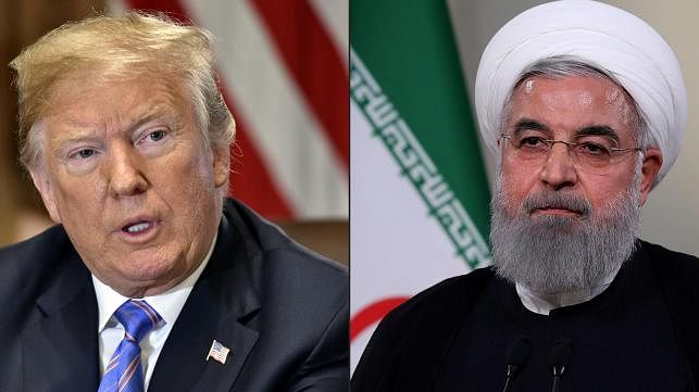 This combination of file pictures created on 23 July 2018 shows US president Donald Trump (L) on 18 July 2018, in Washington, DC; and a 2 May 2018, handout picture provided by the Iranian presidency shows president Hassan Rouhani giving a speech on Iranian TV in Tehran. Photo: AFP