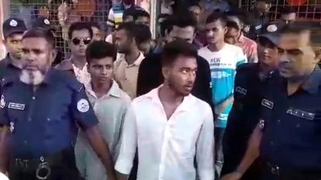 The accused are being led to the prison van on the premises of Barguna court on 3 September. Photo: A video grab
