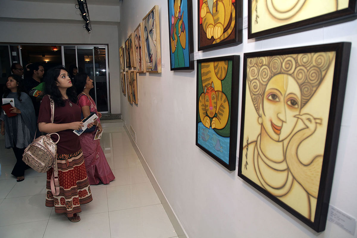 Visitors at Alliance Francaise de Dhaka`s La Galerie in Dhaka on Monday. Photo: Prothom Alo.