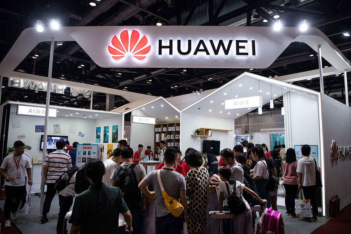 In this file photo taken on 2 August 2019 Attendees visit a Huawei exhibition stand during the Consumer Electronics Expo in Beijing. Huawei`s upcoming flagship Mate 30 smartphone will launch next month without key Google apps, creating a disadvantage for the Chinese tech giant hit by US sanctions. Photo: AFP