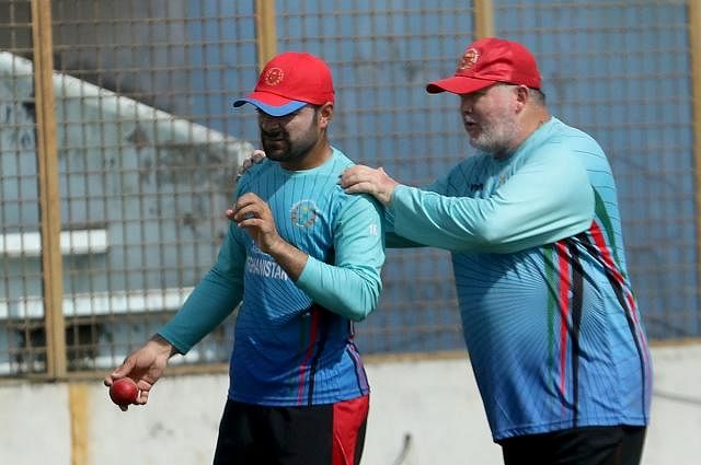 Afghanistan`s spiner Rashid Khan and their coach Andy Moles. File photo