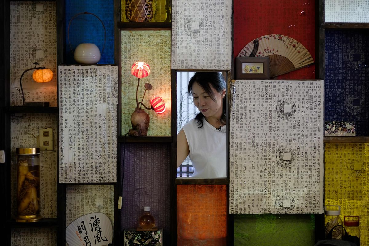 This picture taken on 27 August 2019 shows Korean language teacher Kim Heun-hee at her office in the Shin-Okubo district, known as Tokyo`s Korean town lined with small shops, most of them selling Korean food and pop-culture items. Photo: AFP