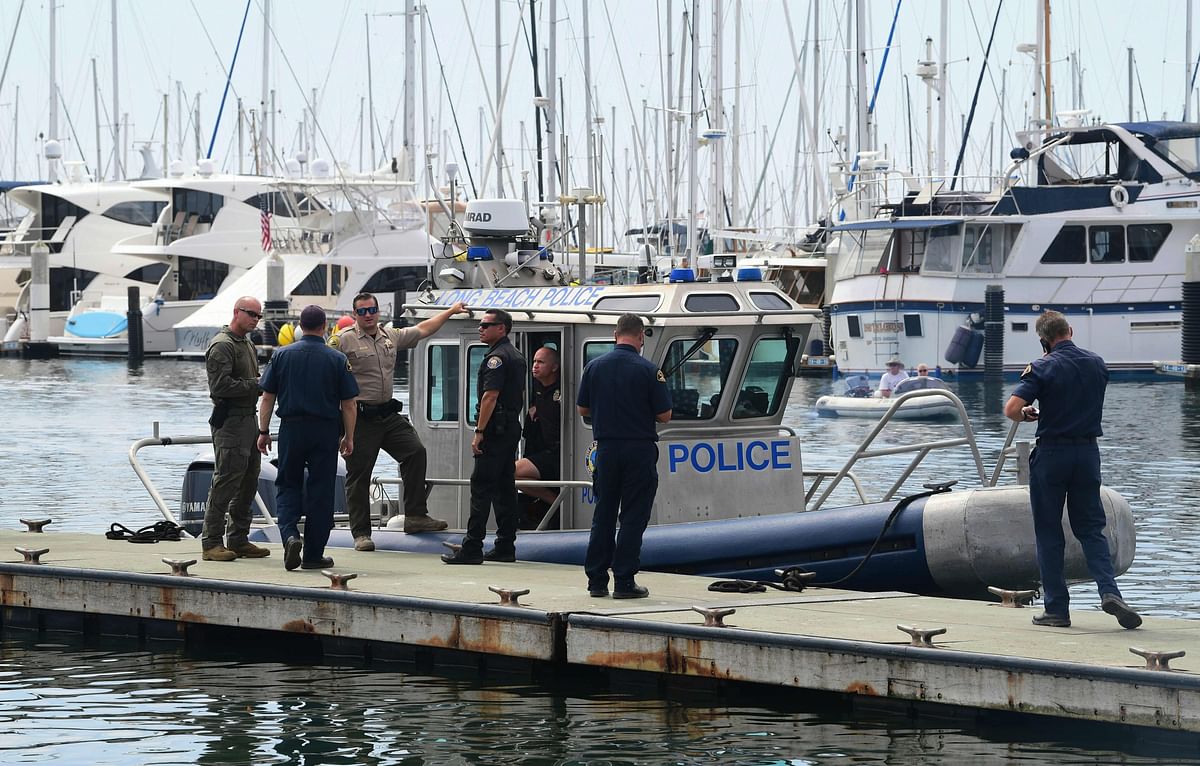 Members of the US Coast Guard meet with California law enforcement officerd near a Long Beach Police vessel in Santa Barbara, California on 3 September. Photo: AFP
