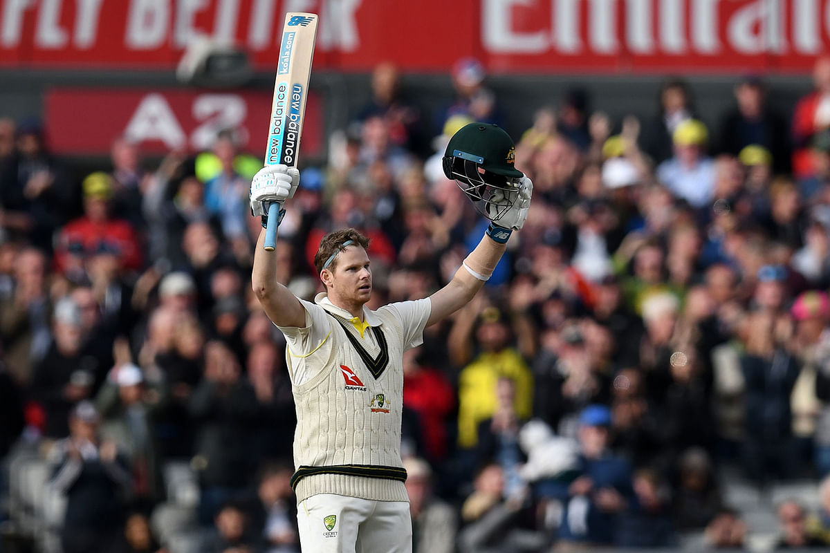 Australia`s Steve Smith celebrates after reaching 200 during play on the second day of the fourth Ashes cricket Test match between England and Australia at Old Trafford in Manchester, north-west England on 5 September 2019. Photo: AFP