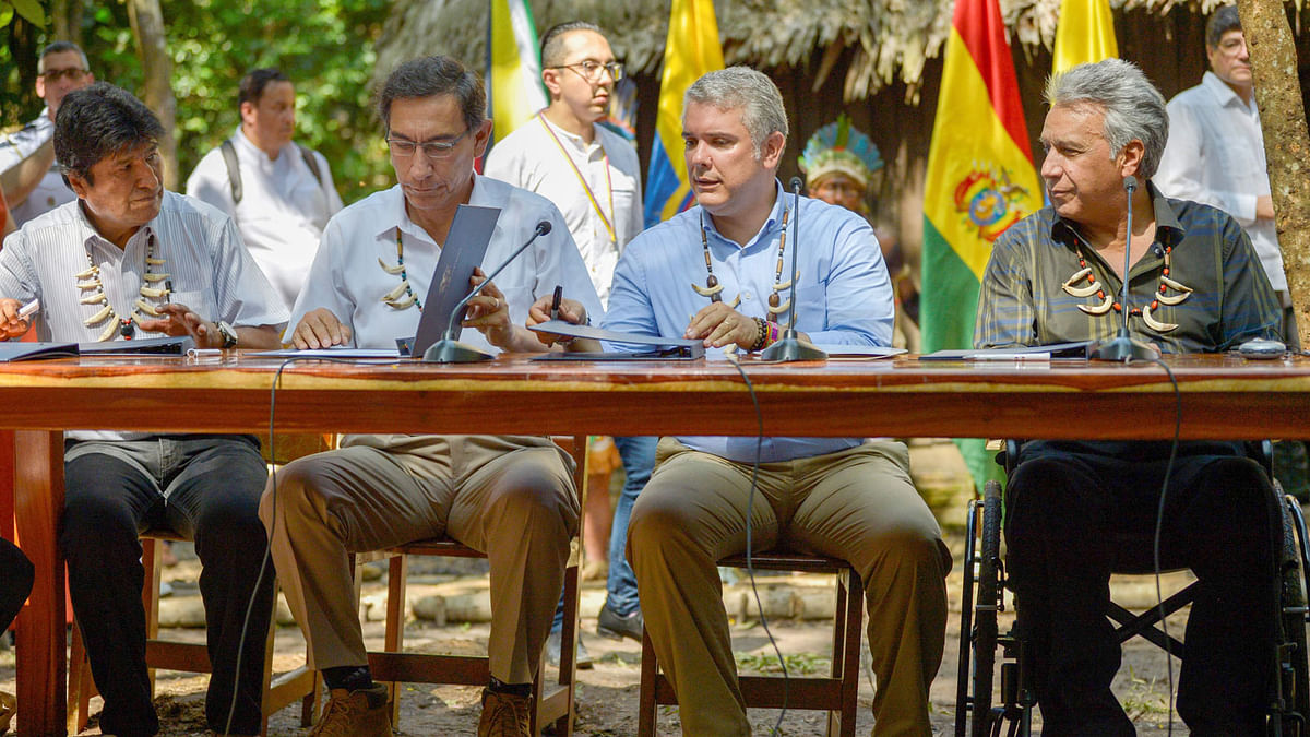 (L-R) Bolivia`s President Evo Morales, Peru`s President Martin Vizcarra, Colombia`s President Ivan Duque and Ecuador`s President Lenin Moreno, sign an agreement during the Presidential Summit for the Amazon at the National University in Leticia, department of Amazonas, Colombia, on Friday. Photo: AFP