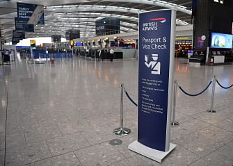 A few passengers walk around the near-deserted departure area at Heathrow airport Terminal 5 in west London on 9 September 2019, as the airline`s first-ever pilots` strike began. British Airways on Monday cancelled almost all flights departing and arriving into the UK, as the airline`s first-ever pilots` strike began, sparking travel chaos for tens of thousands of passengers. Photo: AFP