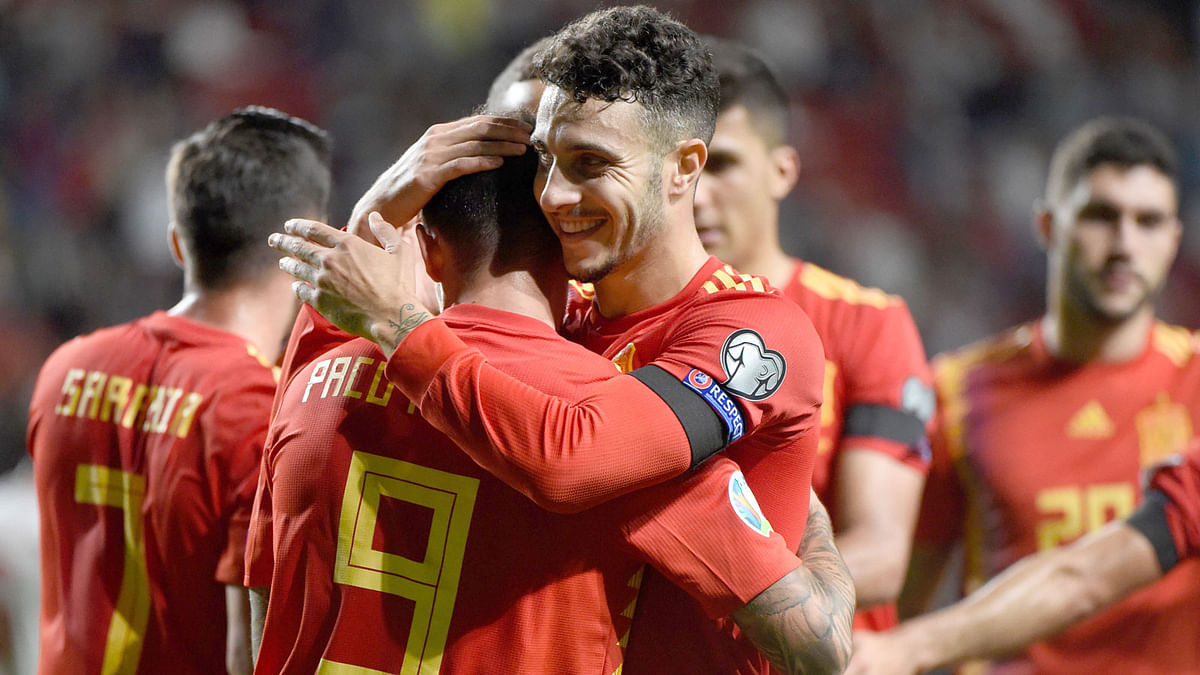 Spain`s forward Paco Alcacer celebrates with teammates after scoring a goal during the UEFA Euro 2020 qualifier group F football match between Spain and Faroe Islands at El Molinon stadium in Gijon on Sunday. Photo: AFP