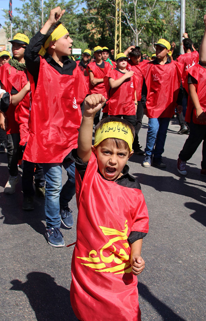 Supporters of Lebanon`s Shiite movement Hezbollah take part in a procession on the tenth day of Muharram which marks the day of Ashura, on 10 September in Baalbek. Photo: AFP