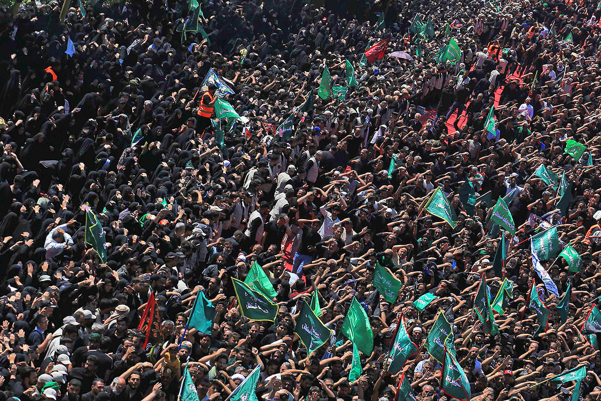 Iraqi Shiite Muslims take part in a mourning procession on the tenth day of the lunar month of Muharram which marks the day of Ashura, in the holy city of Karbala, on 10 September 2019. The day of Ashura is commemorated by Shiite Muslims worldwide and marks the climax of mourning rituals in the Islamic month of Muharram for the 7th century killing of Imam Hussein, the grandson of Prophet Mohammed, in the Battle of Karbala in 680 AD. Photo: AFP