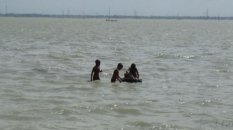 Children have fun swimming in a beel (water body) of Reshambari of Shahjadpur in Sirajganj. Ariful Gani took the piture on 10 September.