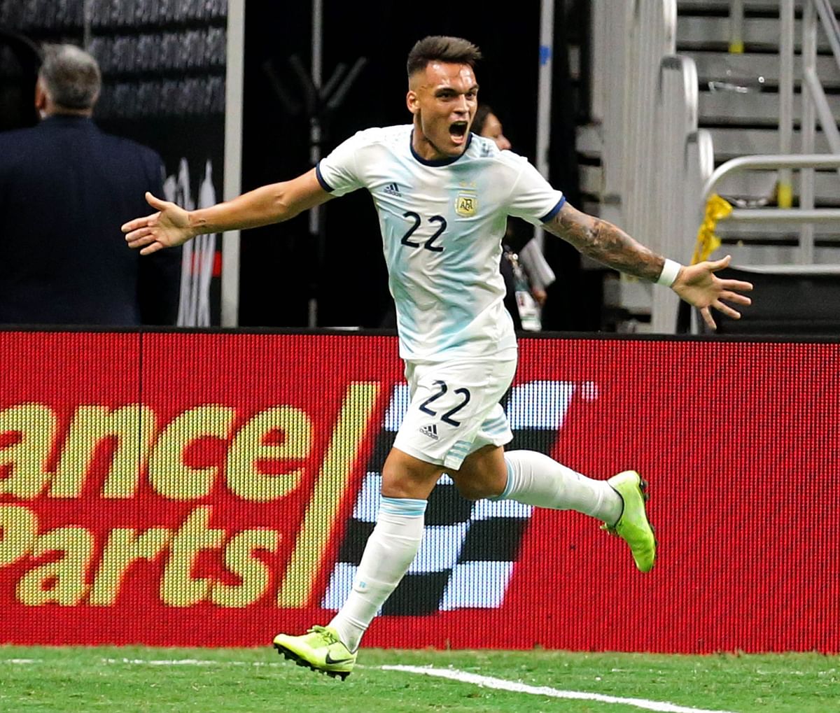 Martinez celebrates scoring one of his three goals. AFP