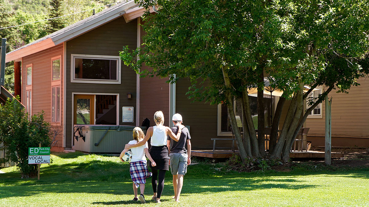Kelly Pfaff walks back to her house with her 11-year-old daughter and 14-year-old son after playing soccer in Park City, Utah, US 14 August. Photo: Reuters