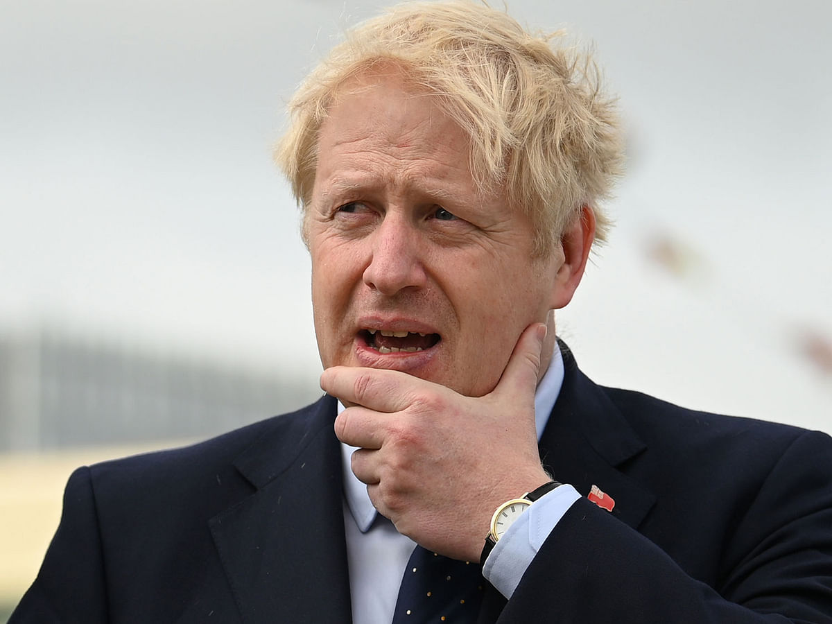 Britain`s prime minister Boris Johnson visits the NLV Pharos, a lighthouse tender moored on the river Thames to mark London International Shipping Week in London on 12 September. Photo: AFP