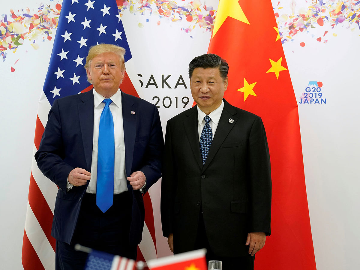 US president Donald Trump and China`s president Xi Jinping pose for a photo ahead of their bilateral meeting during the G20 leaders summit in Osaka, Japan on 29 June. Reuters File Photo