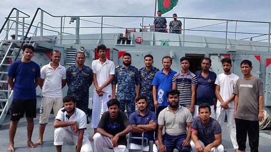 Bangladesh Navy personnel together with 14 rescued sailors of MV Gulf Argo pose for a photograph on Friday morning. Photo: ISPR