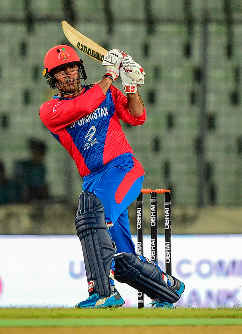 Afghanistan`s Mohammad Nabi plays a shot during the second match between Afghanistan and Zimbfgabwe in the Tri-nations cup T20 series at The Sher-e Bangla National Stadium in Dhaka on 14 September, 2019. Photo: AFP