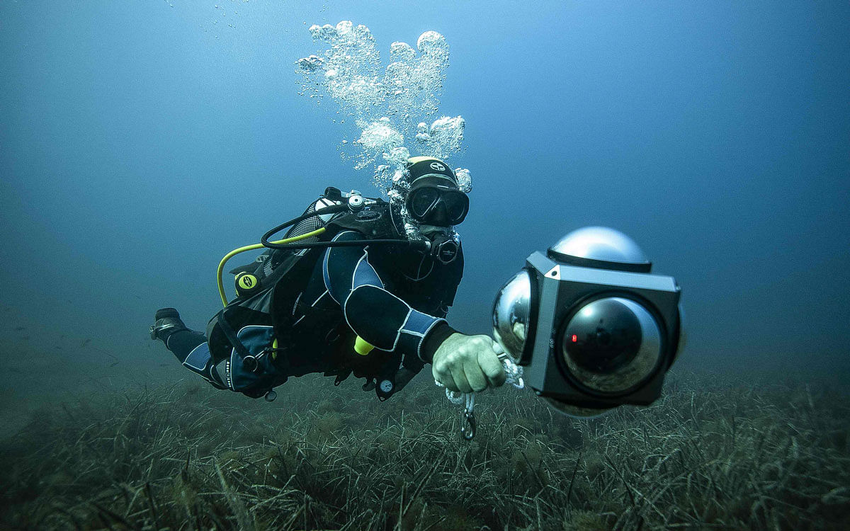 French diver Eric Blin, a water environment and coastline waste-management and biodiversity expert taking part in the `sea@dvanced sound` project, swins with a 360 degree camera to record the movement and reaction of fish to sound off the coast of the Ajaccio, the capital of the French Mediterranean island Corsica on 11 September 2019. Photo: AFP